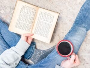 Jolabokaflod: An Icelandic Christmas Tradition for Book-Loving Families. Book and Christmas tree. Reading with coffee. www.inspirethemom.com